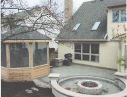 The gazebo on the left next to the Flagstone Patio and Fire Pit